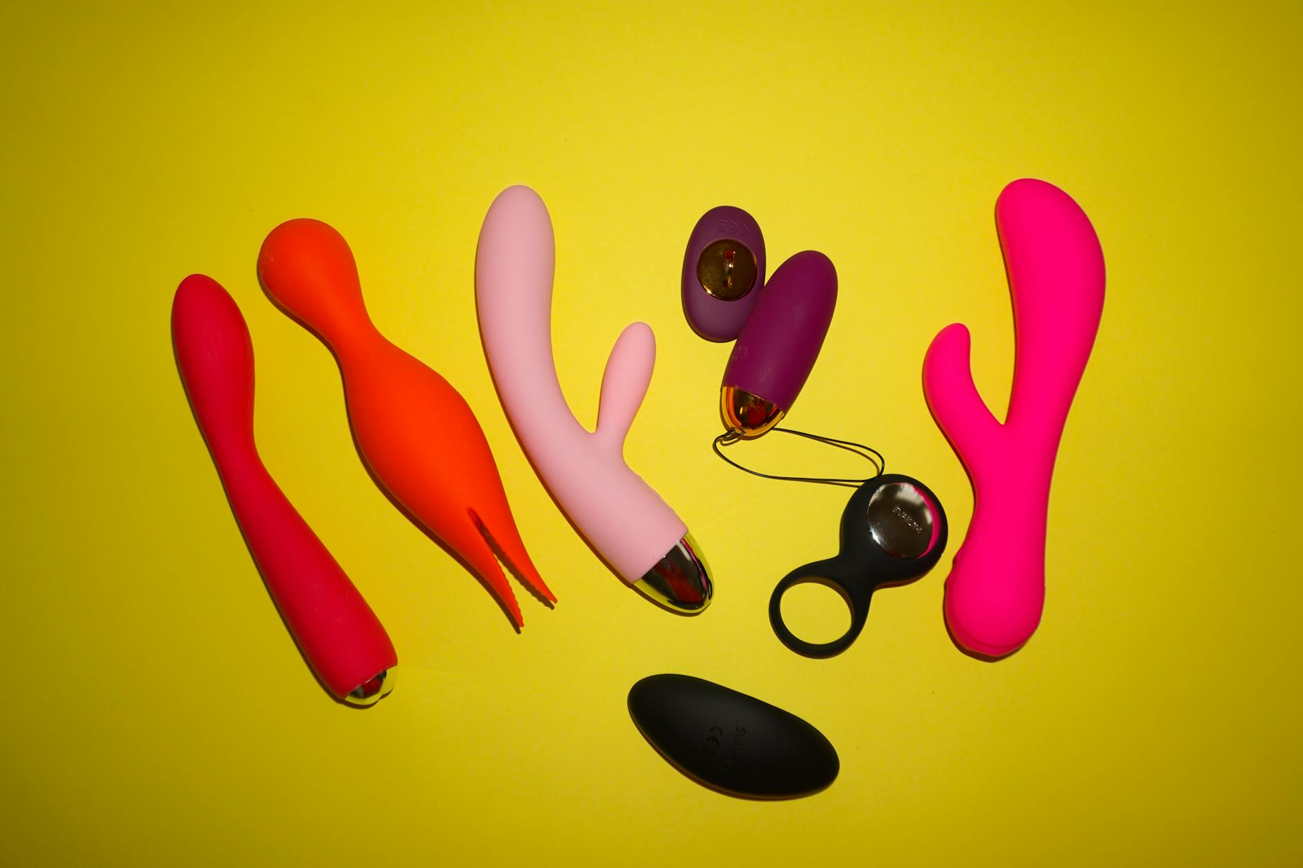 Woman holding a blue vibrator, emphasizing intimate wellness and personal pleasure devices